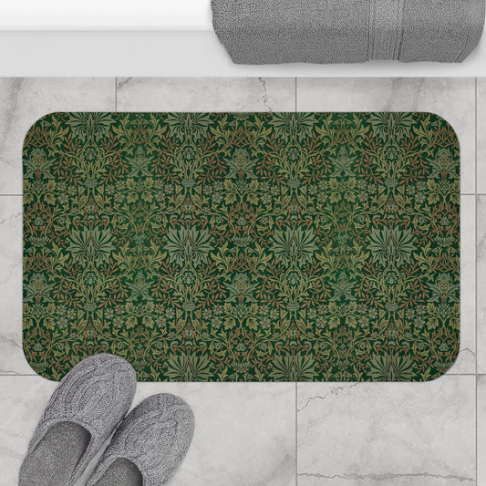 Rectangular microfibre bath mat with an intricate floral pattern in green shades, inspired by William Morris.