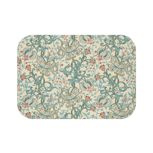 Rectangular microfibre bath mat with a floral pattern inspired by William Morris, in colours green, beige, and pink.