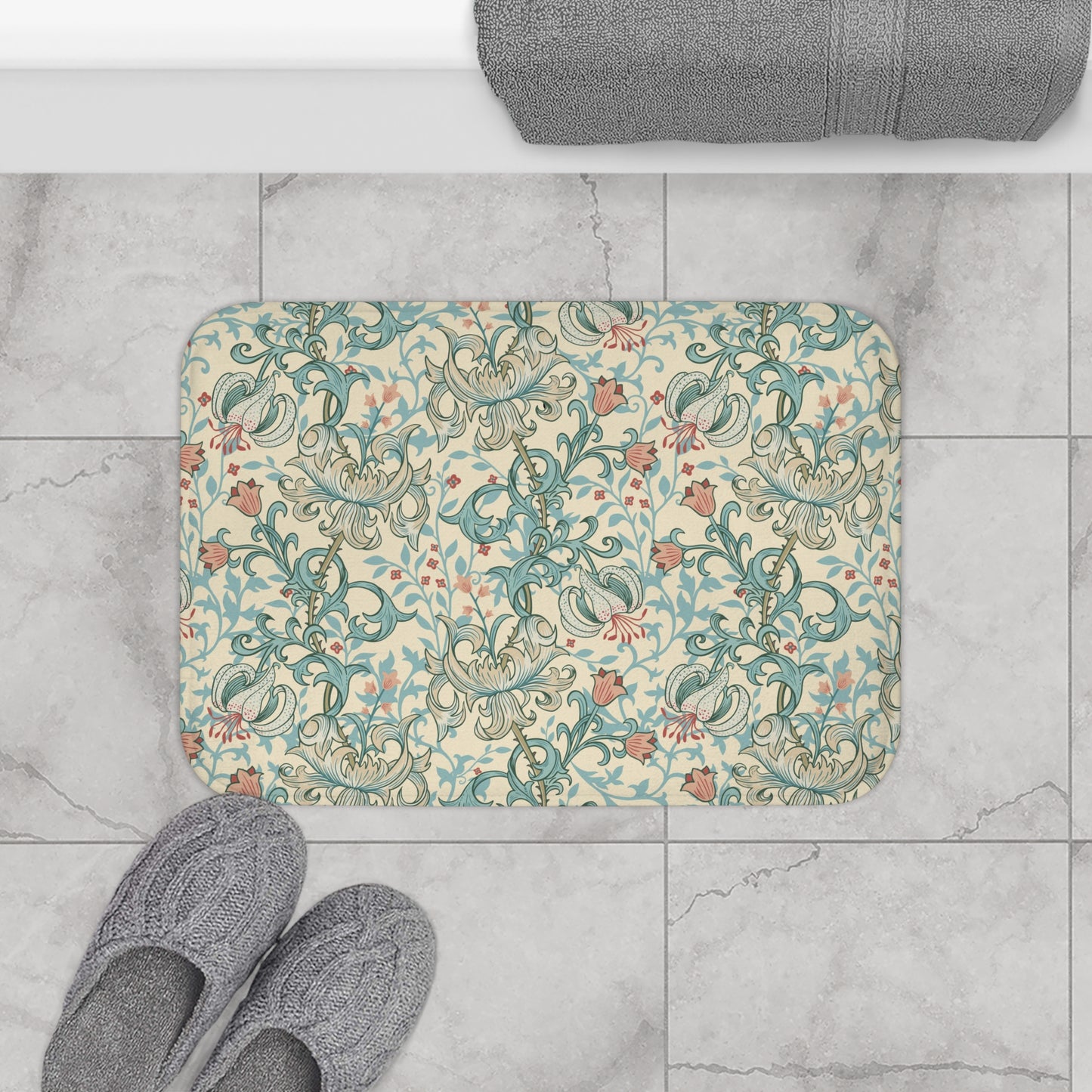 Rectangular microfibre bath mat with a floral pattern inspired by William Morris, in colours green, beige, and pink.