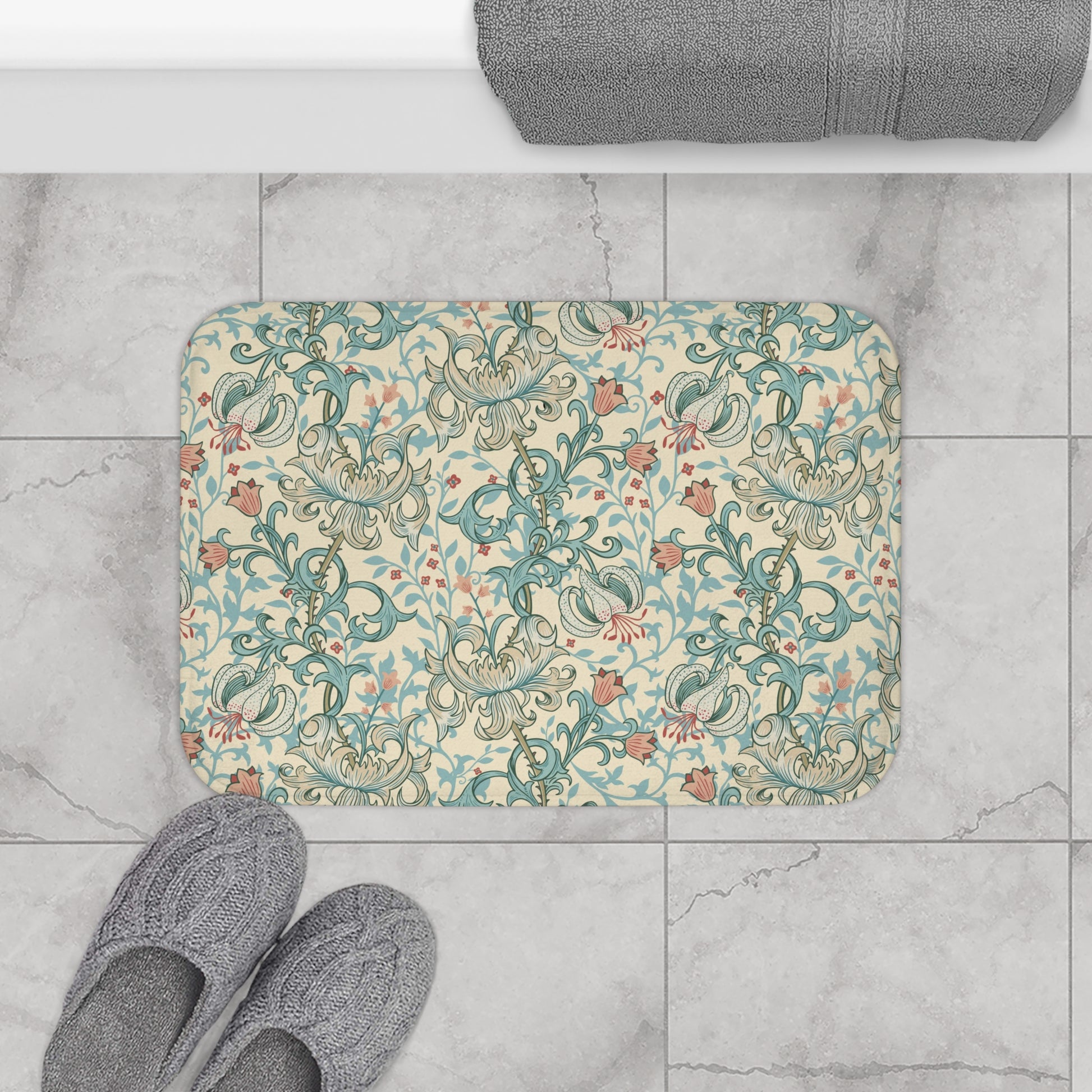 Rectangular microfibre bath mat with a floral pattern inspired by William Morris, in colours green, beige, and pink.