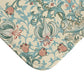 Rectangular microfibre bath mat with a floral pattern inspired by William Morris, in colours green, beige, and pink.