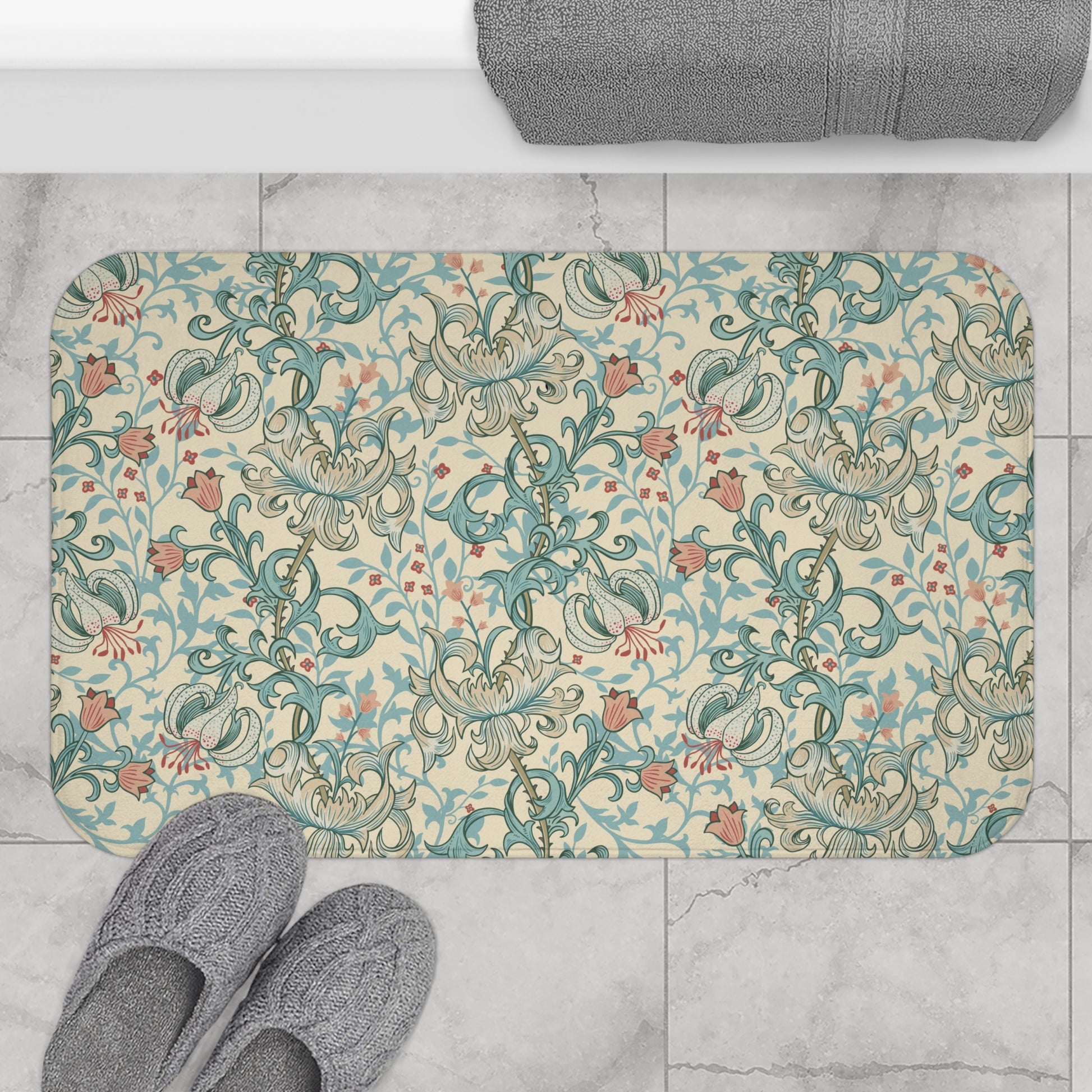 Rectangular microfibre bath mat with a floral pattern inspired by William Morris, in colours green, beige, and pink.