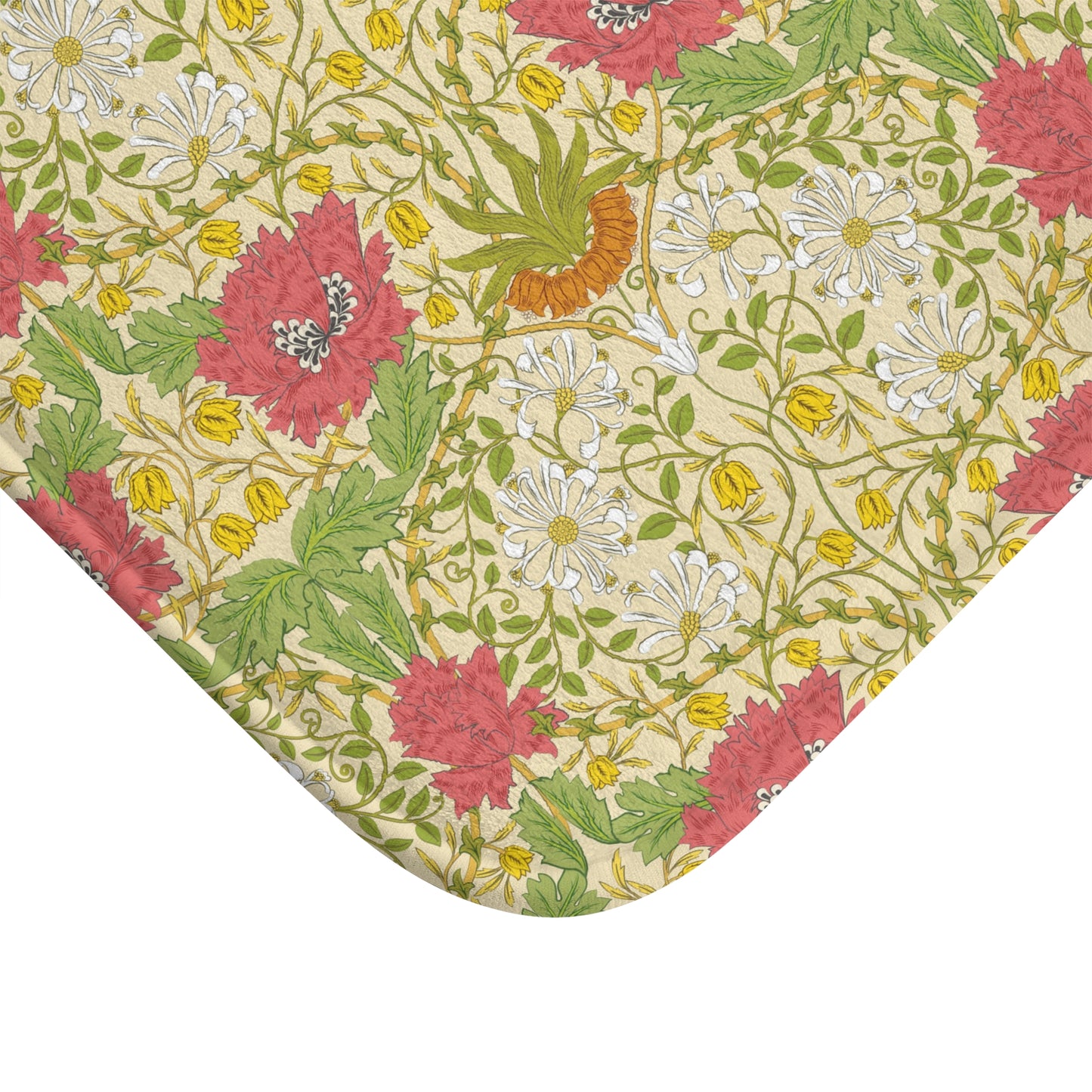 A rectangular microfibre bath mat with a floral pattern inspired by William Morris, in colours green, pink, yellow, and white.