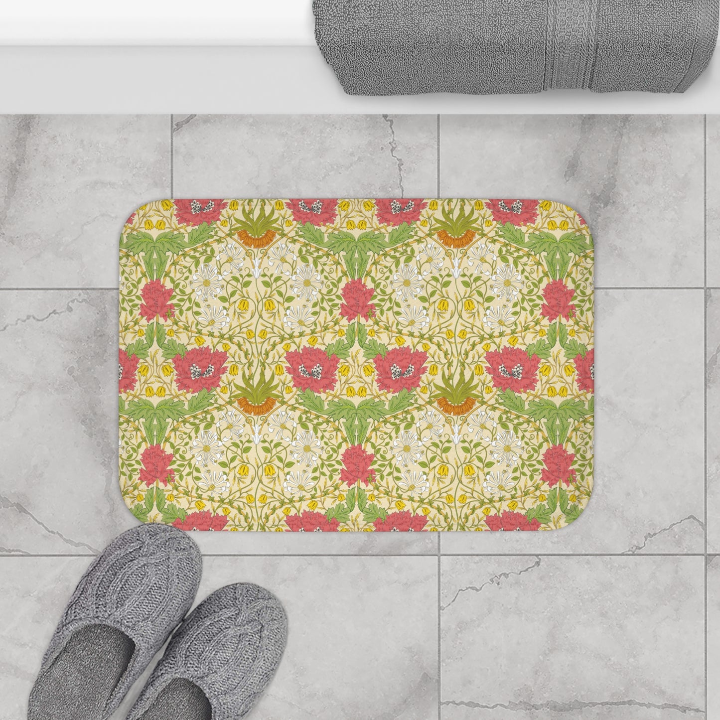 A rectangular microfibre bath mat with a floral pattern inspired by William Morris, in colours green, pink, yellow, and white.