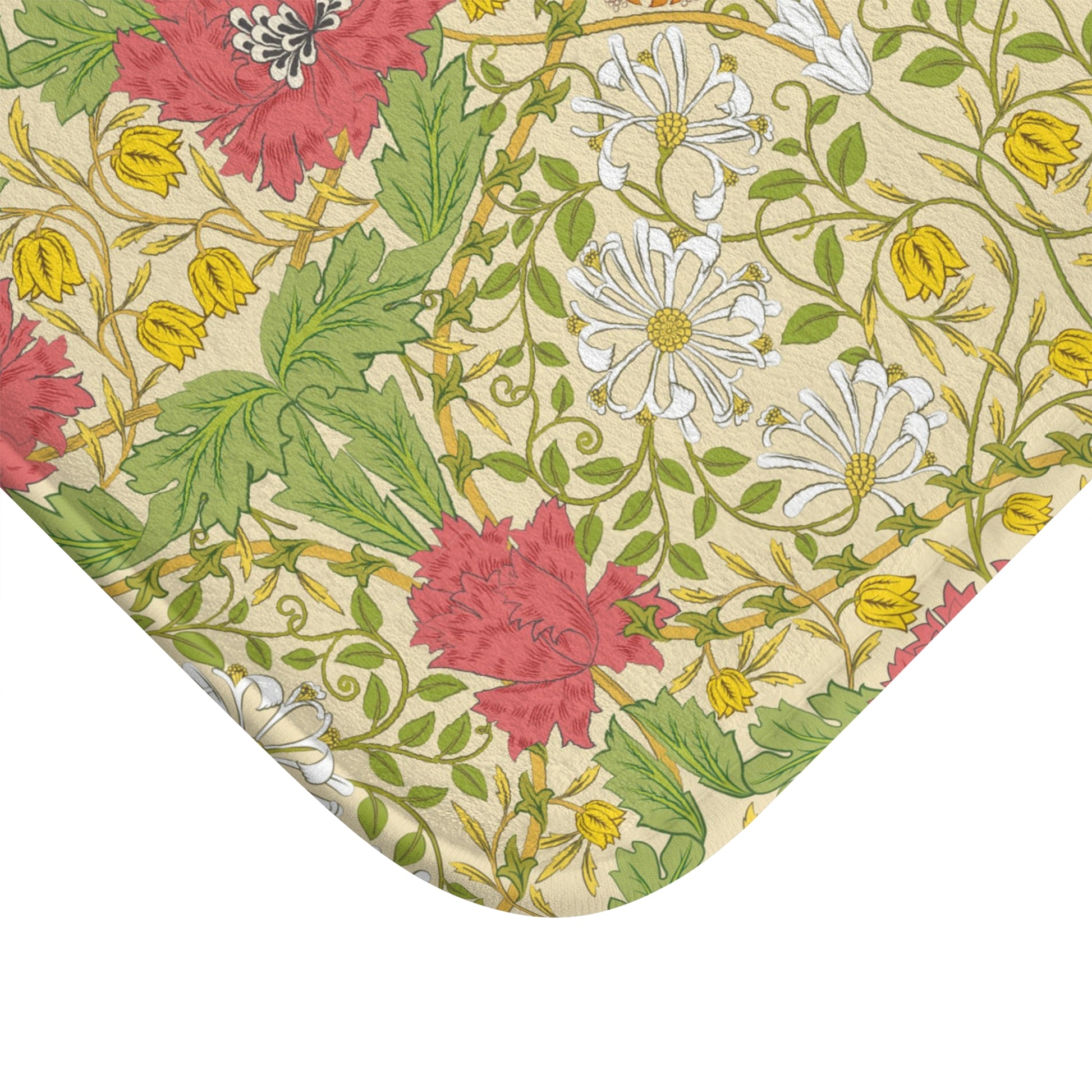 A rectangular microfibre bath mat with a floral pattern inspired by William Morris, in colours green, pink, yellow, and white.