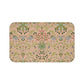 A rectangular microfibre bath mat with a floral pattern inspired by William Morris, in colors pink, green, and white.