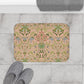 A rectangular microfibre bath mat with a floral pattern inspired by William Morris, in colours pink, green, and white.
