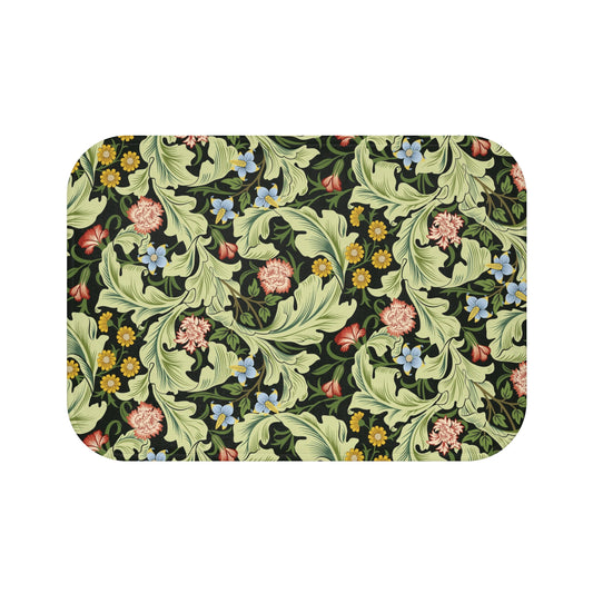Microfibre bath mat with a green background featuring floral patterns inspired by William Morris.