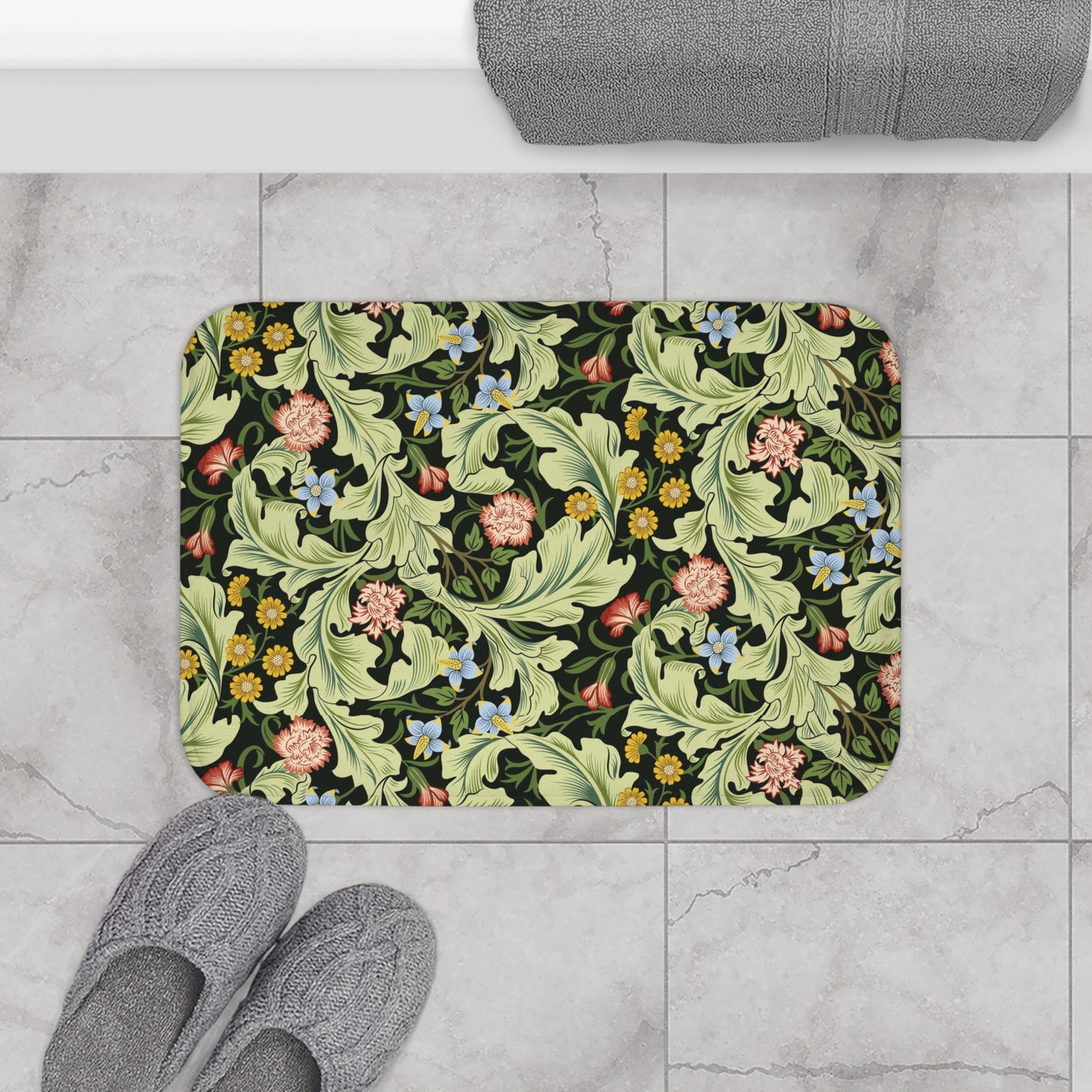 Microfibre bath mat with a green background featuring floral patterns inspired by William Morris.