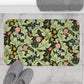 Microfibre bath mat with a green background featuring floral patterns inspired by William Morris.