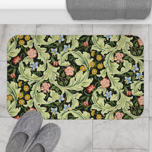 Microfibre bath mat with a green background featuring floral patterns inspired by William Morris.