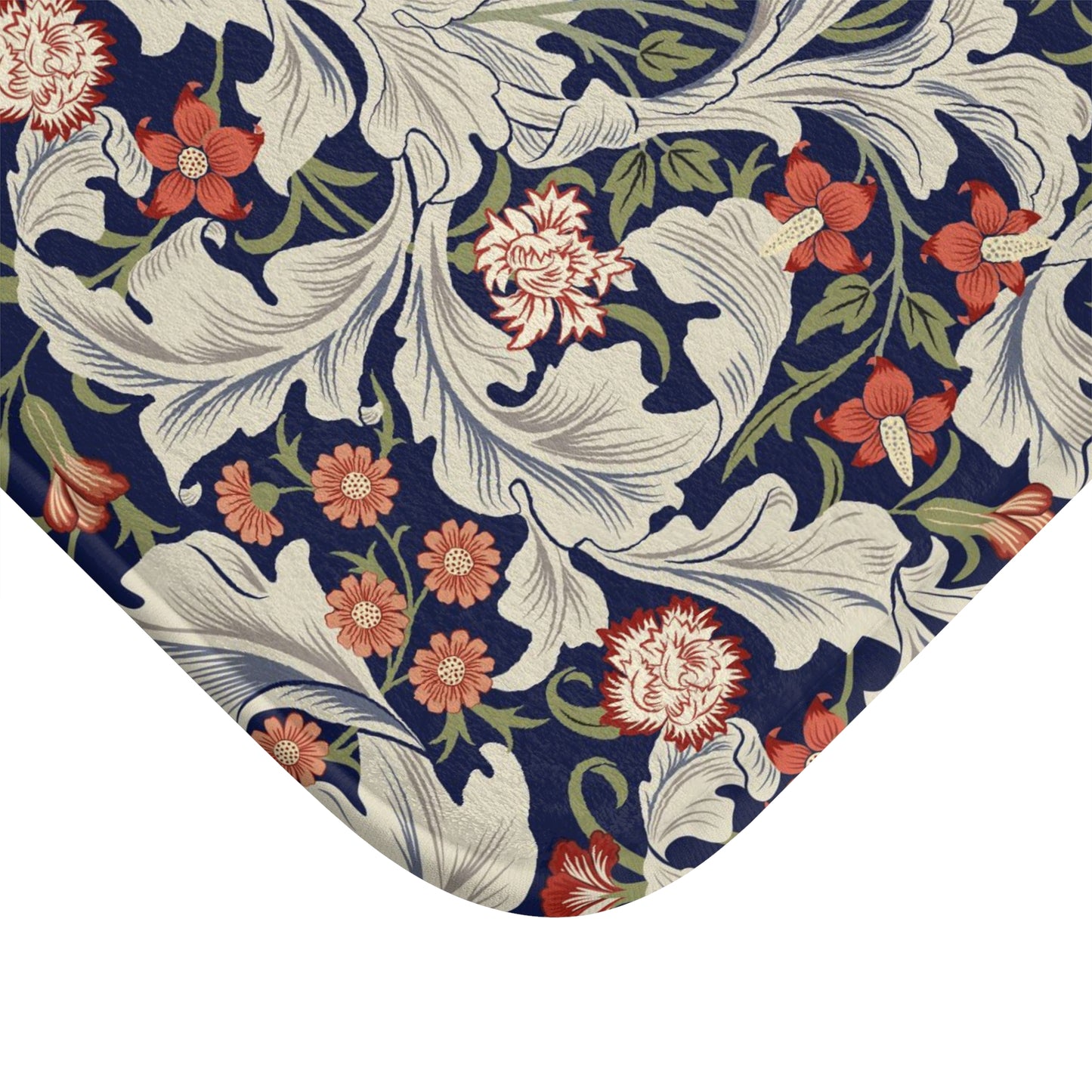A rectangular microfibre bath mat with a floral pattern inspired by William Morris, predominantly in blue and white colours.