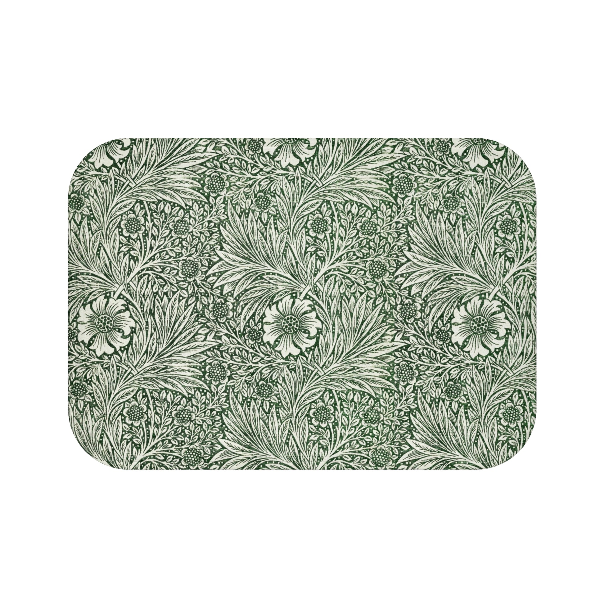 A rectangular microfibre bath mat with an all-over print of green and white floral patterns inspired by William Morris.