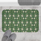 Black and white patterned doormat on a tiled floor with slippers and a towel.