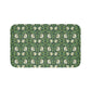 A rectangular mat with rounded corners featuring a repeating William Morris-style floral pattern in green and cream, shown on a plain white background.