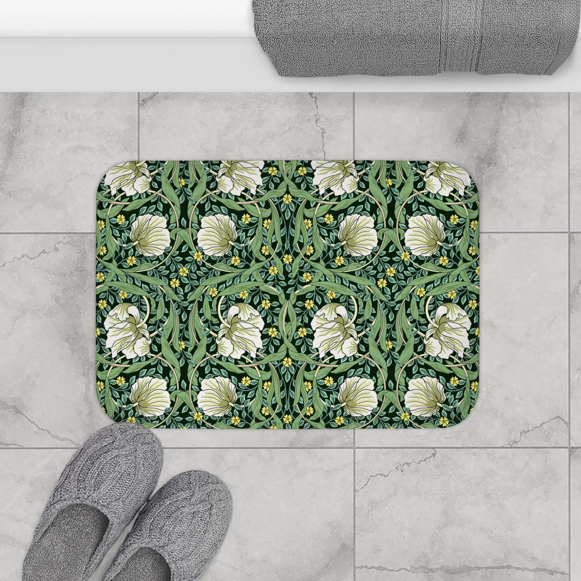 Microfibre bath mat with a green floral pattern inspired by William Morris, featuring a non-slip backing.
