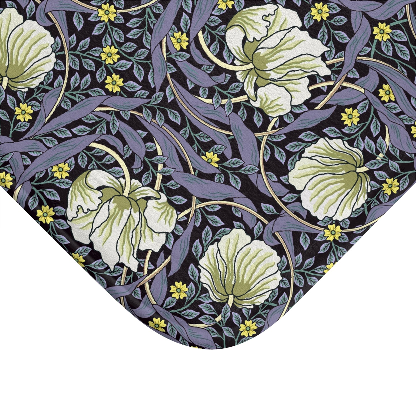 A rectangular microfibre bath mat with a floral pattern in shades of purple and green, inspired by William Morris' design.