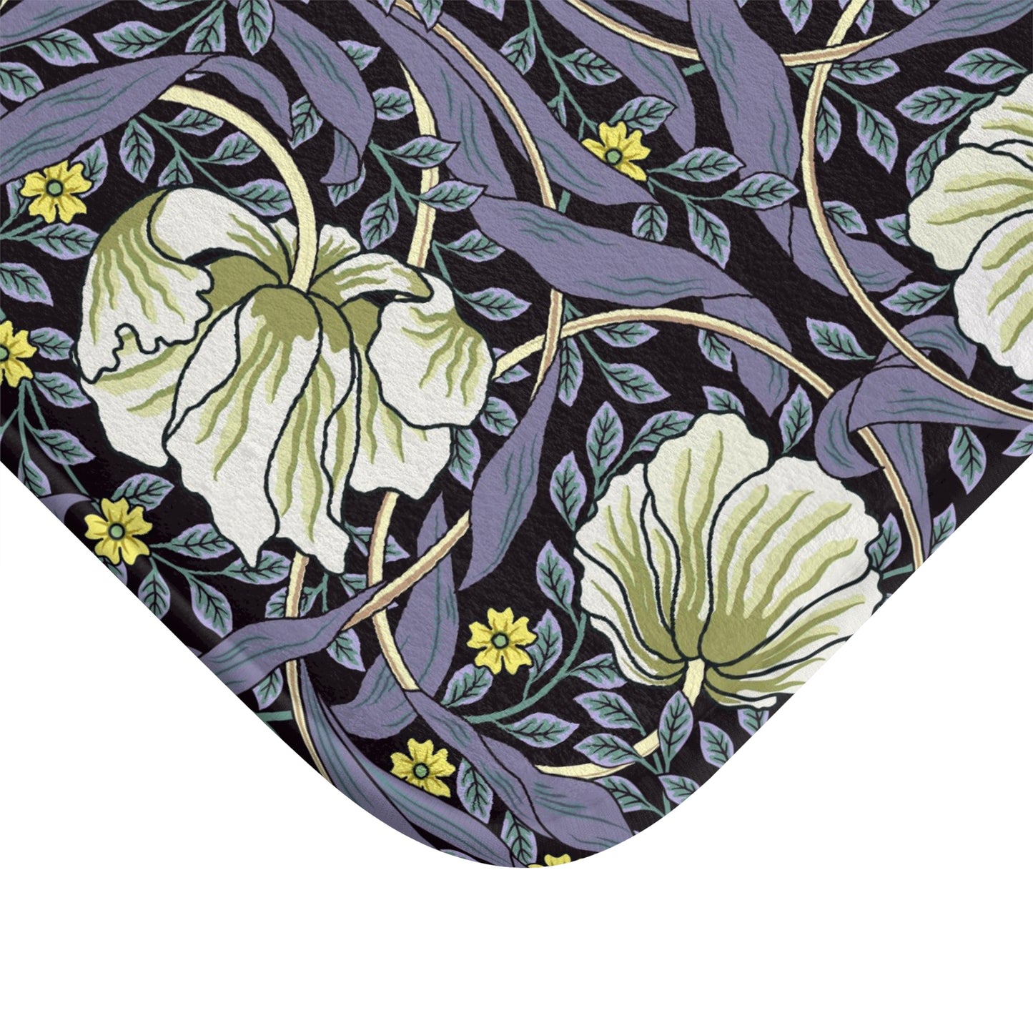 A rectangular microfibre bath mat with a floral pattern in shades of purple and green, inspired by William Morris' design.