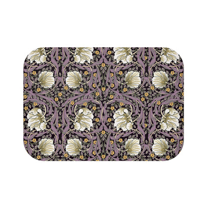 Floral patterned doormat with white flowers on a dark background