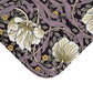 Floral patterned fabric with white flowers and purple leaves on a black background