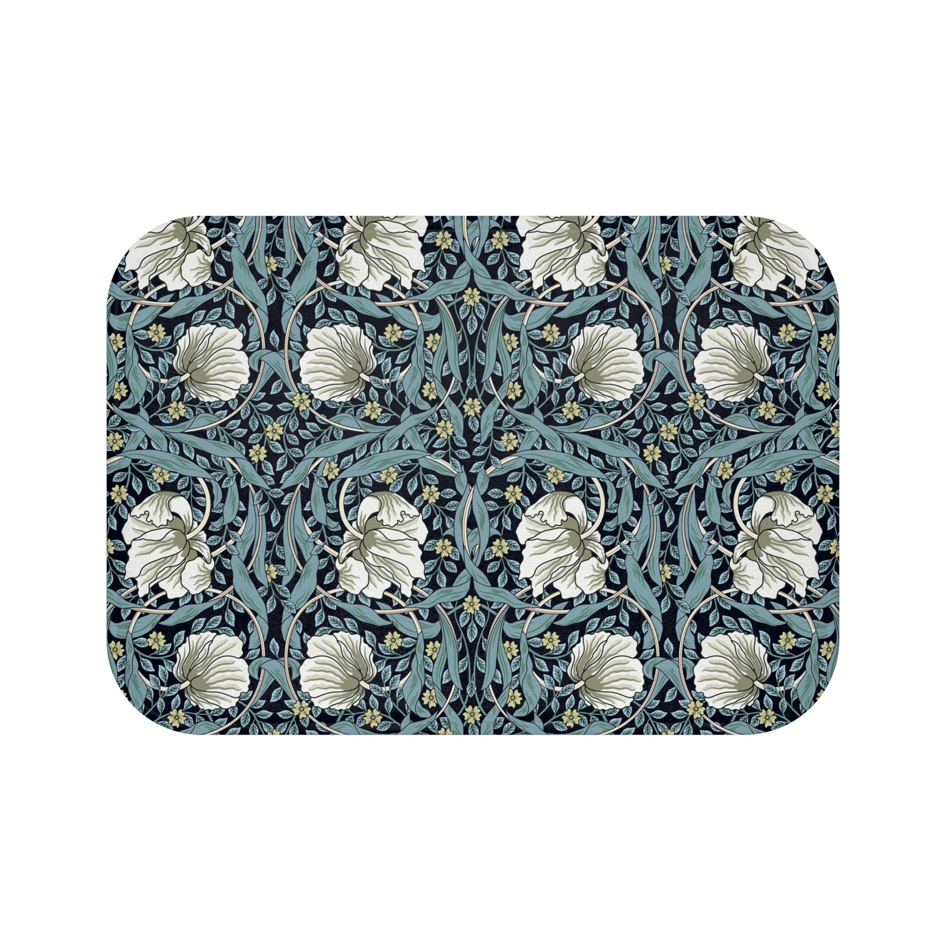 A rectangular microfibre bath mat with a floral pattern in shades of blue and white, inspired by William Morris' design.
