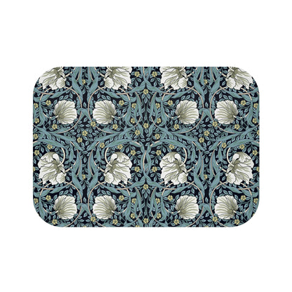 A rectangular microfibre bath mat with a floral pattern in shades of blue and white, inspired by William Morris' design.