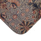 A rectangular microfibre bath mat with a floral pattern inspired by William Morris, in colours predominantly brown and green.