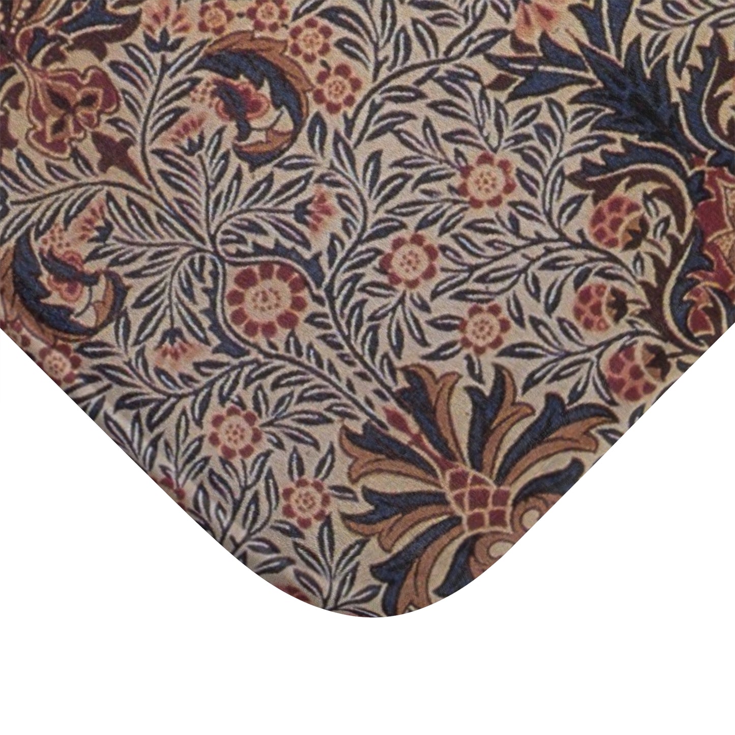 A rectangular microfibre bath mat with a floral pattern inspired by William Morris, in colours predominantly brown and green.