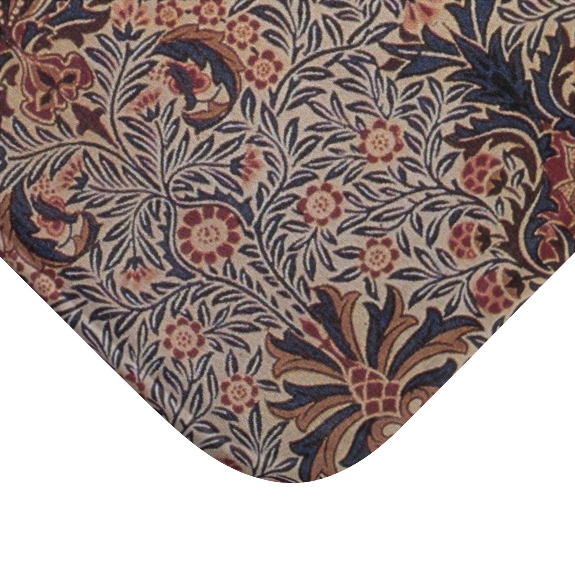 A rectangular microfibre bath mat with a floral pattern inspired by William Morris, in colours predominantly brown and green.