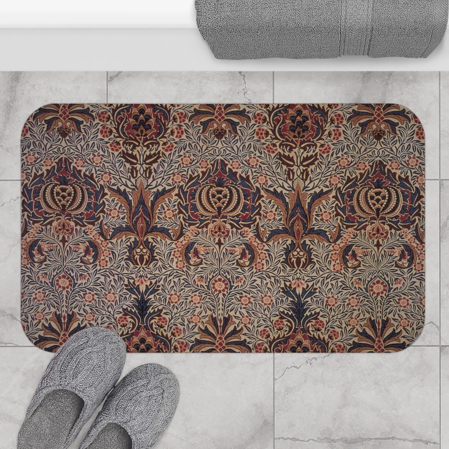 A rectangular microfibre bath mat with a floral pattern inspired by William Morris, in colours predominantly brown and green.