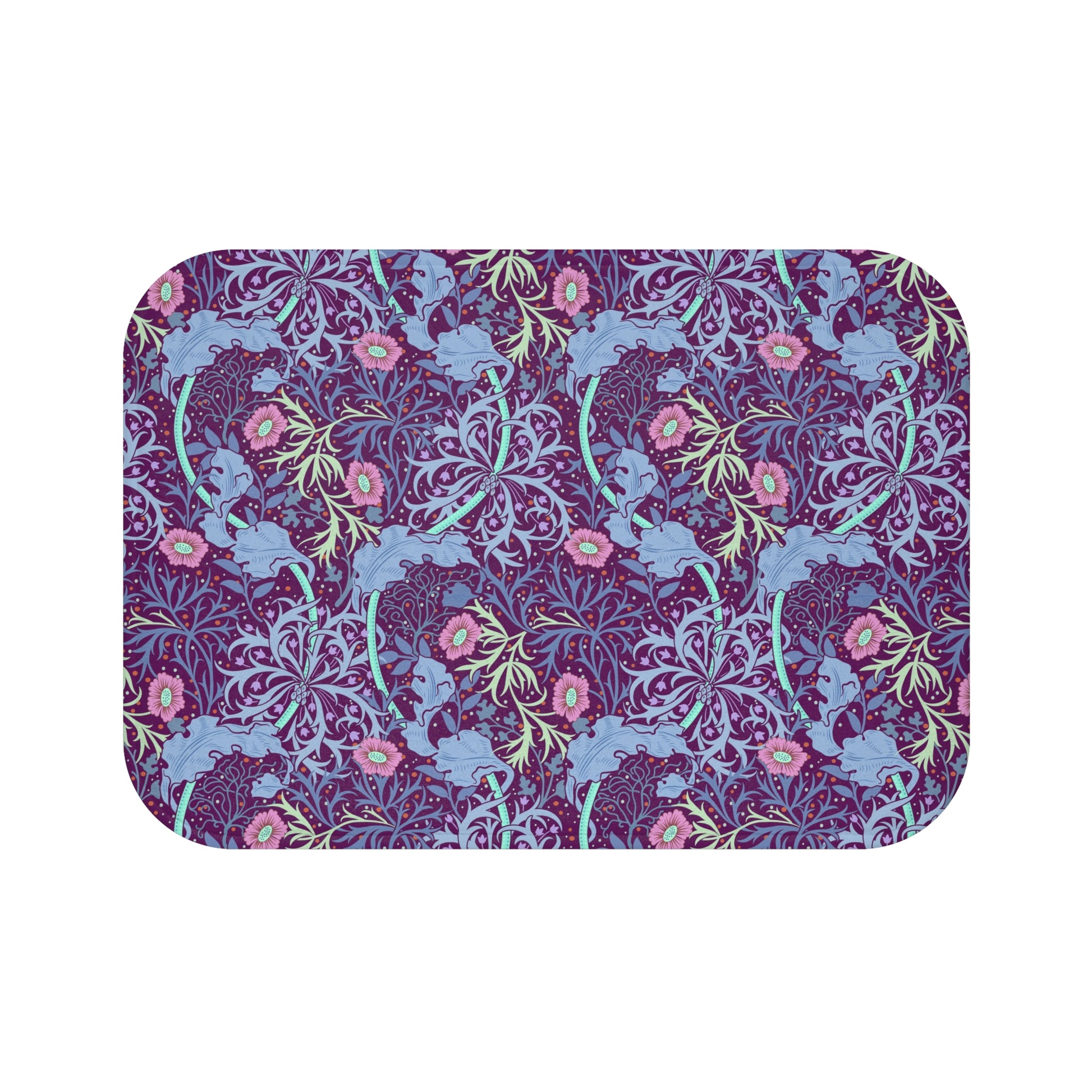 Rectangular microfibre bath mat with a pink flower and seaweed pattern inspired by William Morris.