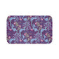 Rectangular microfibre bath mat with a pink flower and seaweed pattern inspired by William Morris.