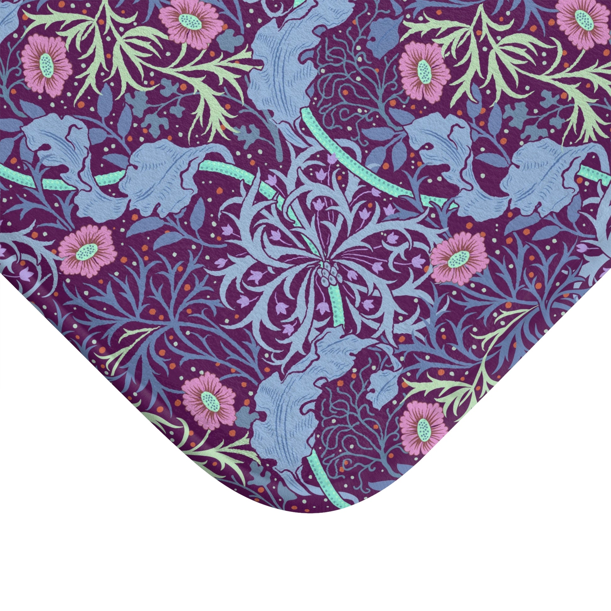 Rectangular microfibre bath mat with a pink flower and seaweed pattern inspired by William Morris.