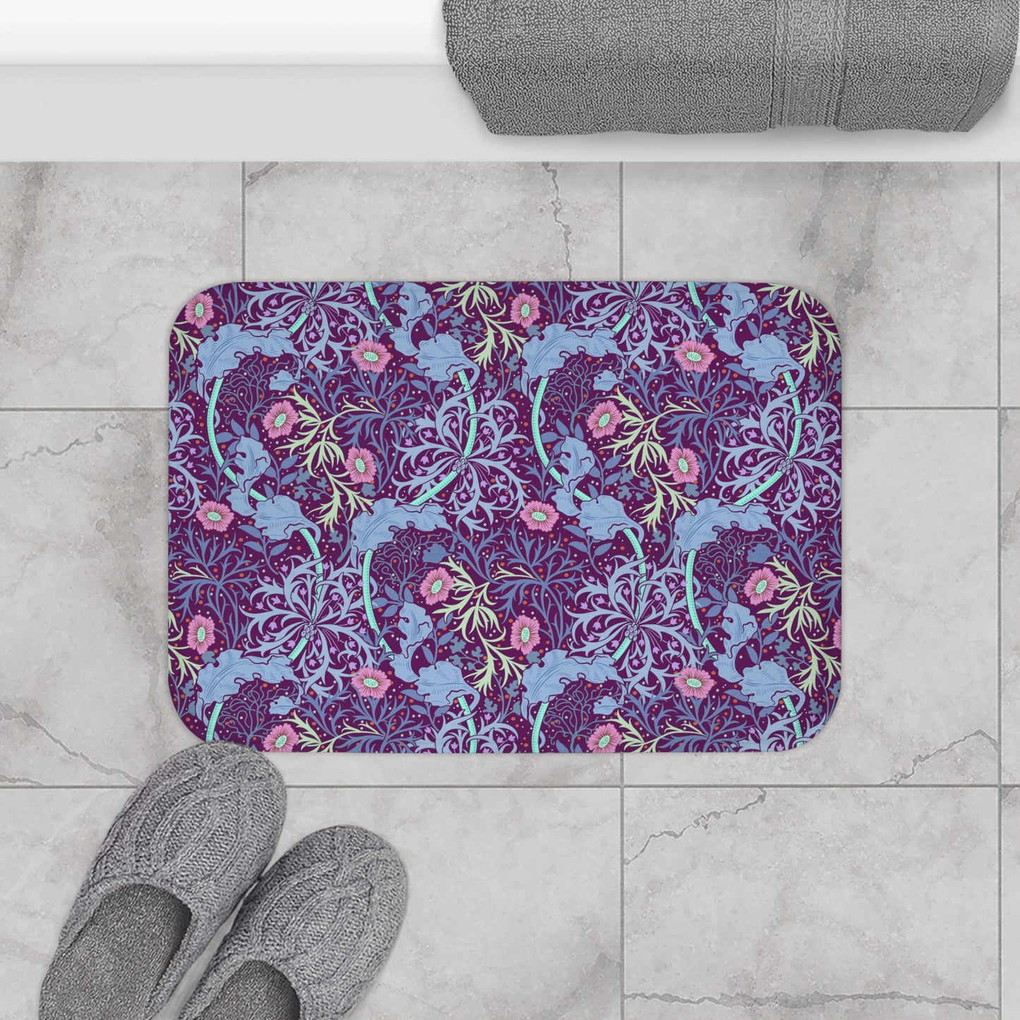 Rectangular microfibre bath mat with a pink flower and seaweed pattern inspired by William Morris.