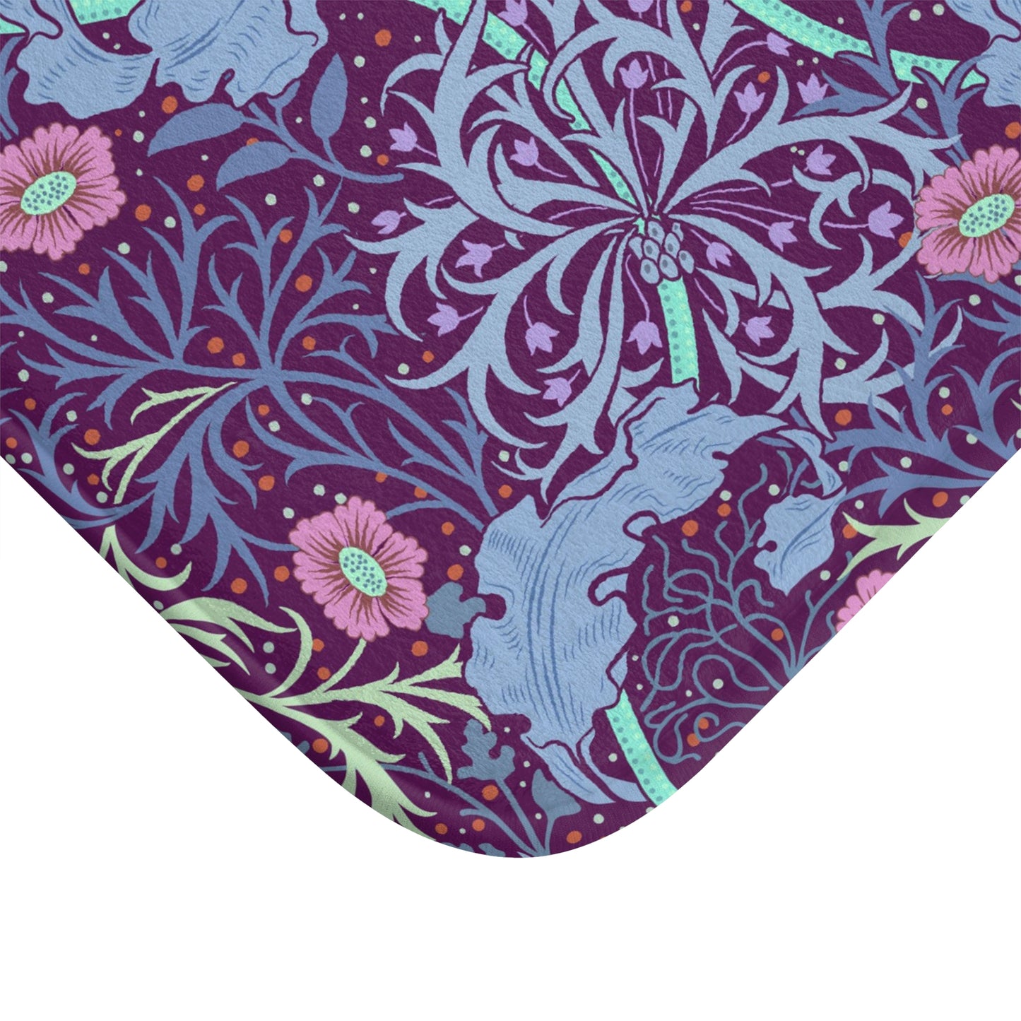 Rectangular microfibre bath mat with a pink flower and seaweed pattern inspired by William Morris.