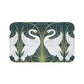 Decorative mat with swan design on a green background
