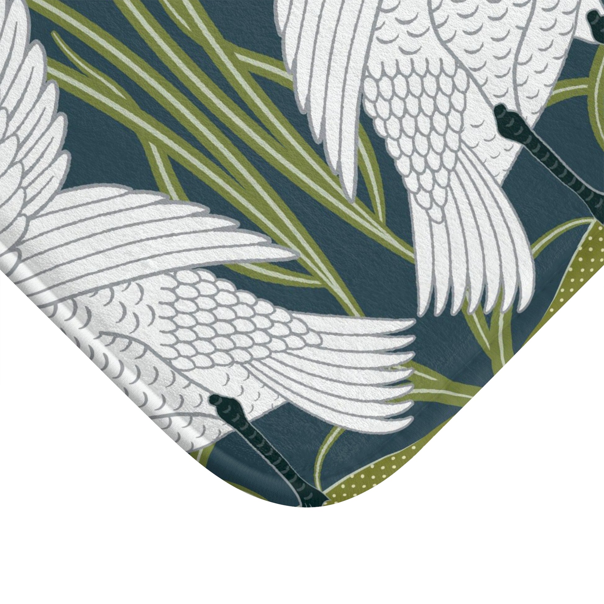 Close-up of a fabric with white bird patterns on a dark blue background