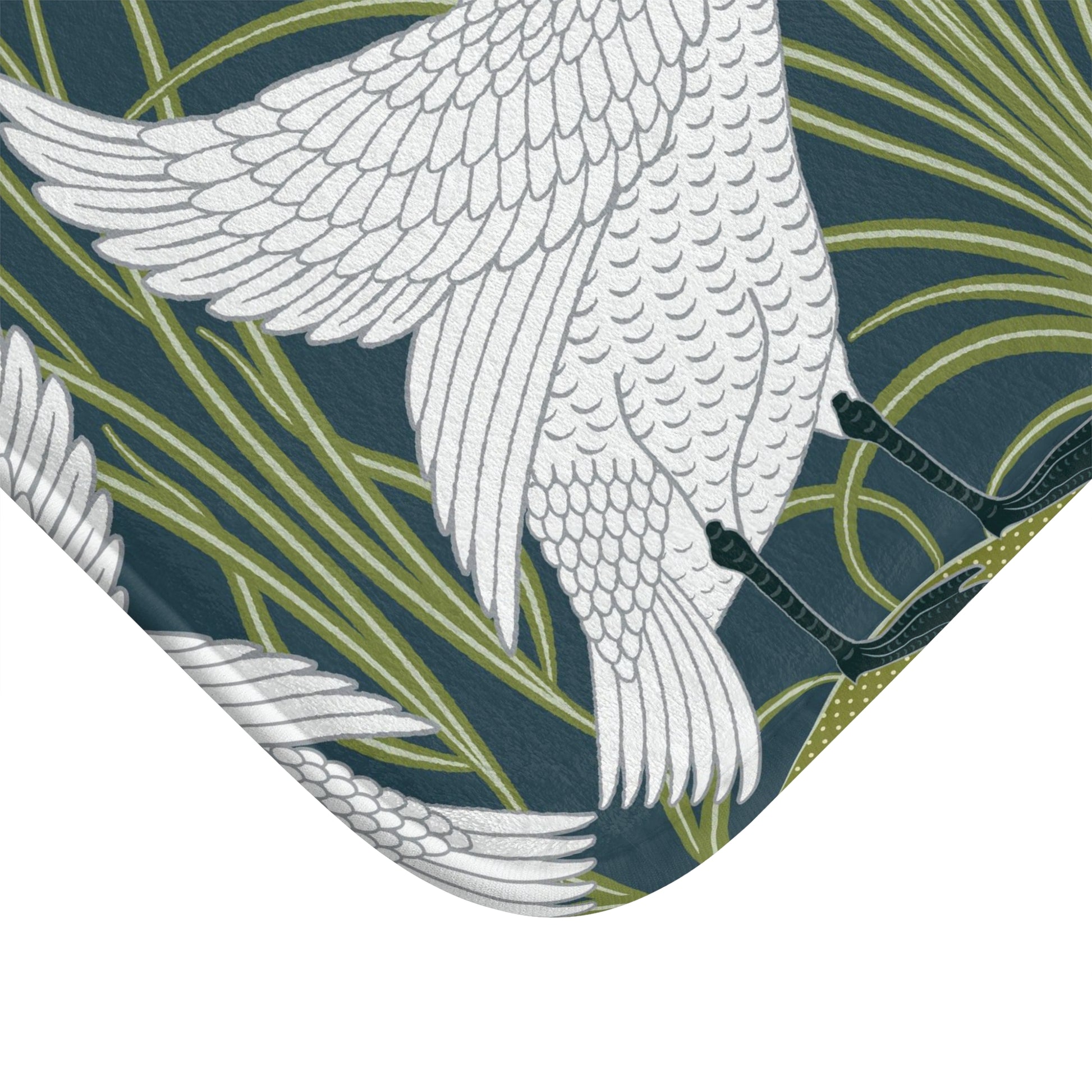 Patterned fabric with white bird design on a green and blue background