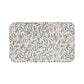Rectangular mat with leaf pattern on a white background