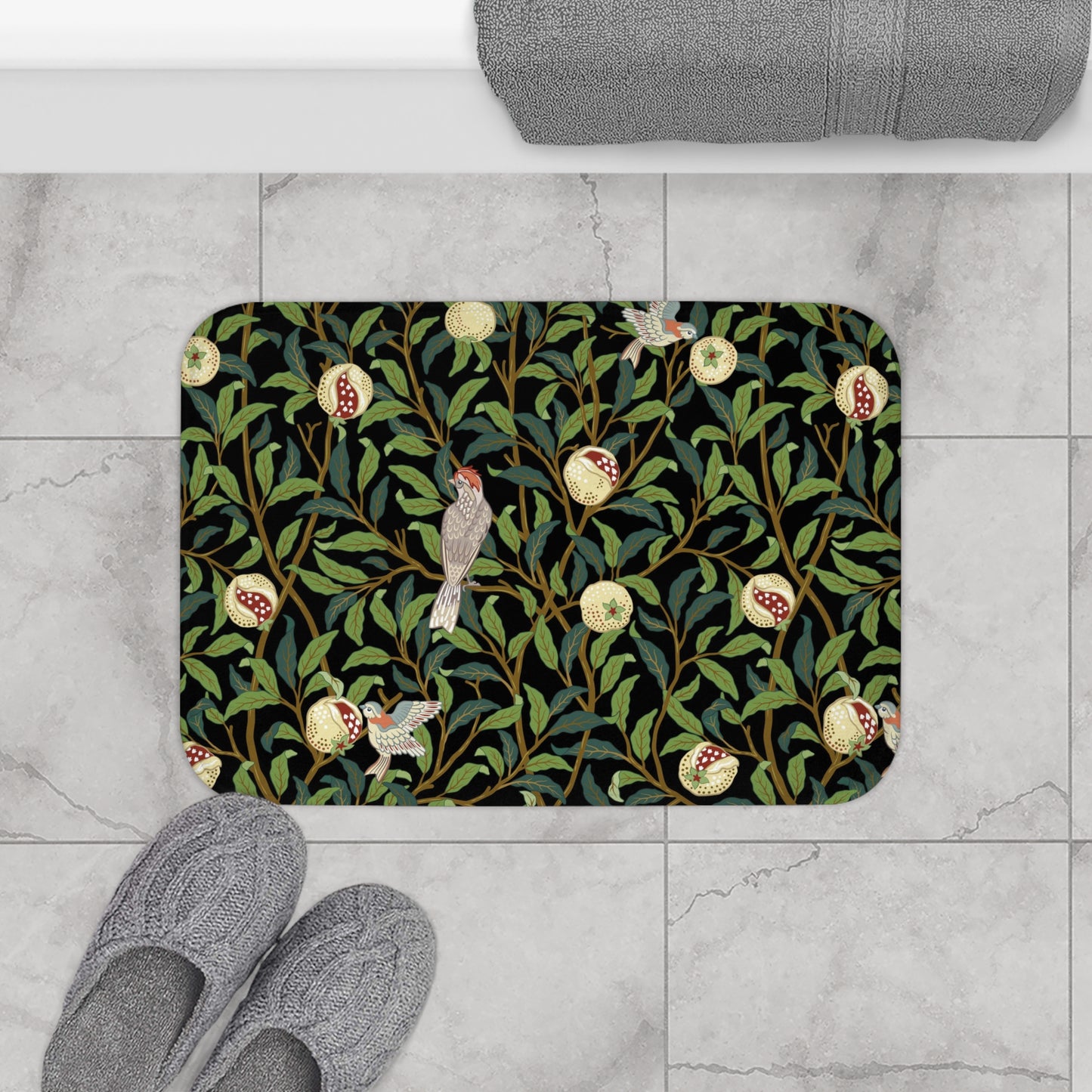 Microfibre bath mat with a design inspired by William Morris featuring birds and pomegranates on a dark background.