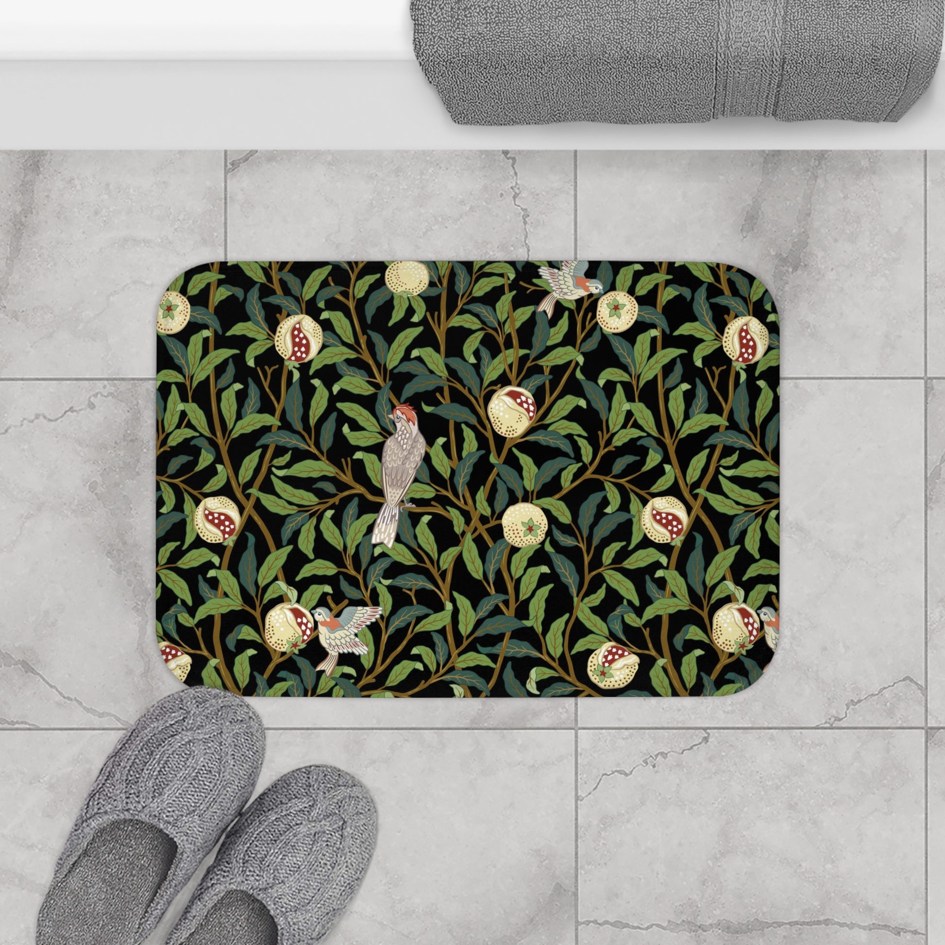 Microfibre bath mat with a design inspired by William Morris featuring birds and pomegranates on a dark background.