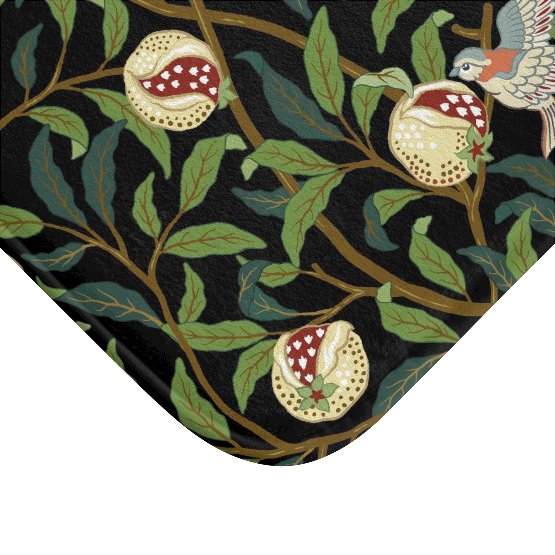 Microfibre bath mat with a design inspired by William Morris featuring birds and pomegranates on a dark background.