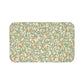 Microfibre bath mat with a floral pattern featuring birds and pomegranates in a beige color inspired by William Morris.