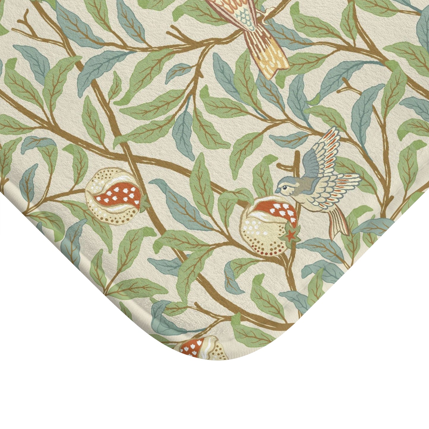 Microfibre bath mat with a floral pattern featuring birds and pomegranates in a beige colour inspired by William Morris.