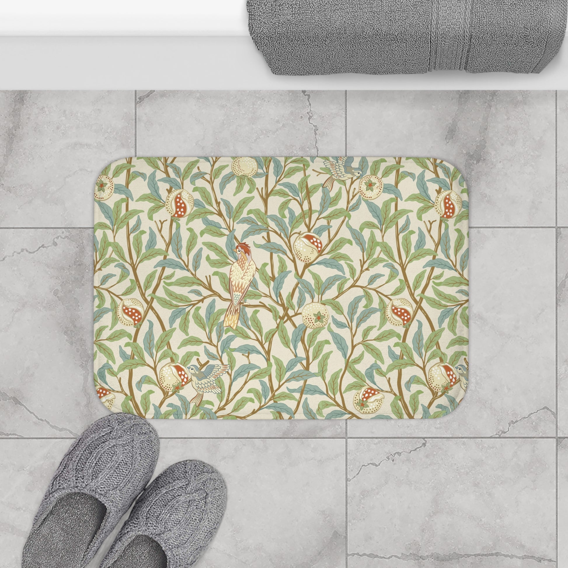 Microfibre bath mat with a floral pattern featuring birds and pomegranates in a beige colour inspired by William Morris.