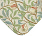 Microfibre bath mat with a floral pattern featuring birds and pomegranates in a beige colour inspired by William Morris.