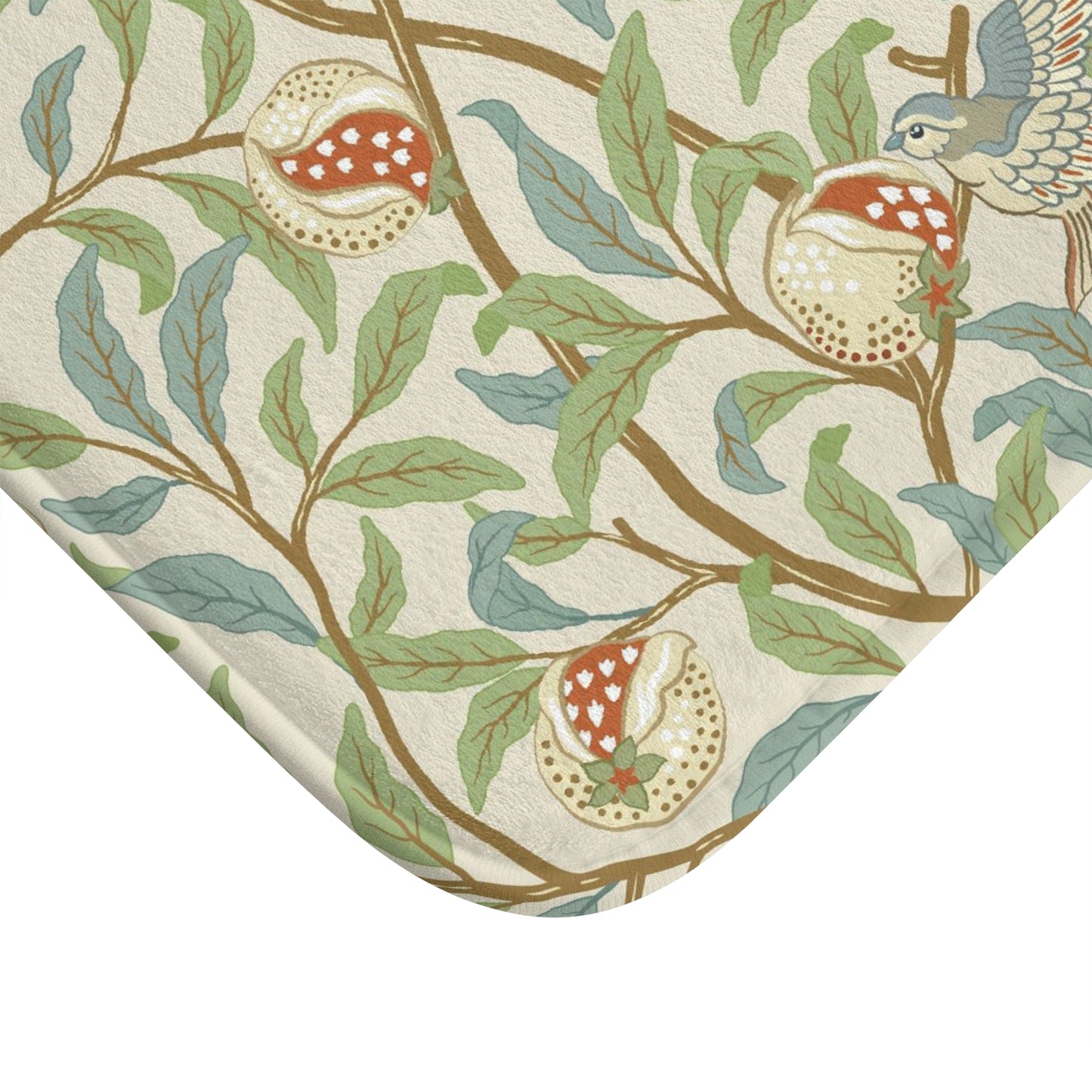 Microfibre bath mat with a floral pattern featuring birds and pomegranates in a beige colour inspired by William Morris.