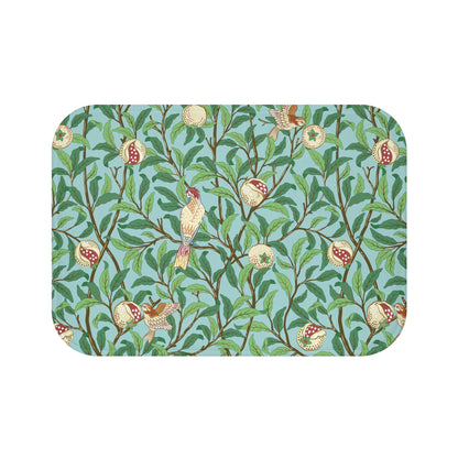 A rectangular microfibre bath mat with a Tiffany Blue background featuring an elegant William Morris bird and pomegranate pattern.