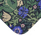 A rectangular microfibre bath mat with a floral pattern inspired by William Morris, predominantly blue and green in colour.