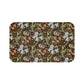 A rectangular microfibre bath mat with a floral pattern inspired by William Morris, predominantly in dark colors with a mix of lilies and other foliage.
